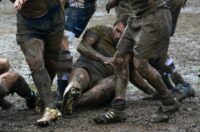 Fallen muddy rugby player