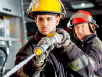 Two firefighters with hose